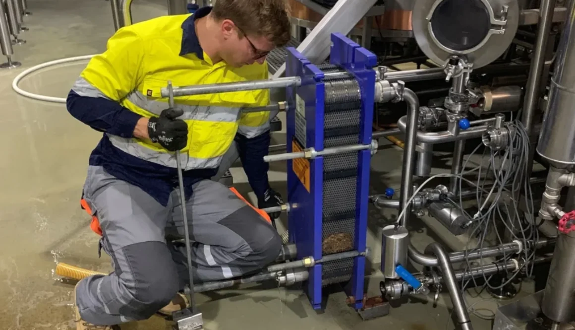 Guy inspecting plate heat exchanger