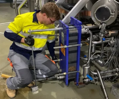 Guy inspecting plate heat exchanger